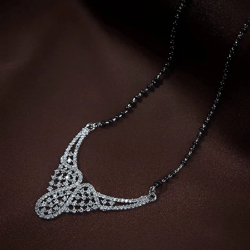 Grab Your Favorite Jewelry At The Lowest Prices Etnico 18k Rhodium Plated Traditional Single Line American Diamond Pendant with Black Bead Chain Mangalsutra for Women (D080) Grab Your Favorite Jewelry At The Lowest Prices Etnico 18k Rhodium Plated Traditional Single Line American Diamond Pendant with Black Bead Chain Mangalsutra for Women (D080)